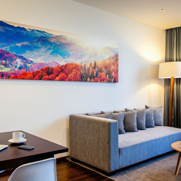 Living area with long sofa in Junior Suite at Fiesta Inn