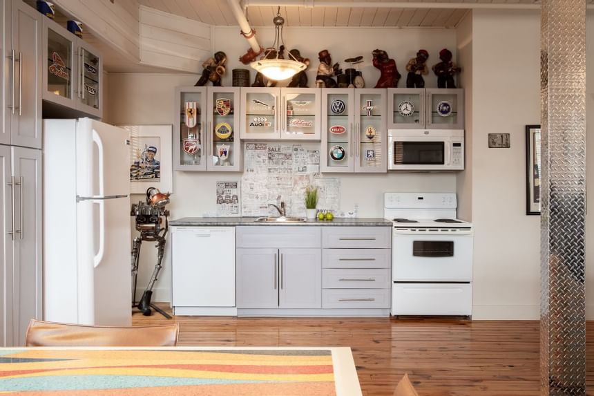 Kitchenette with dining table in Apartment 407 at Retro Suites Hotel