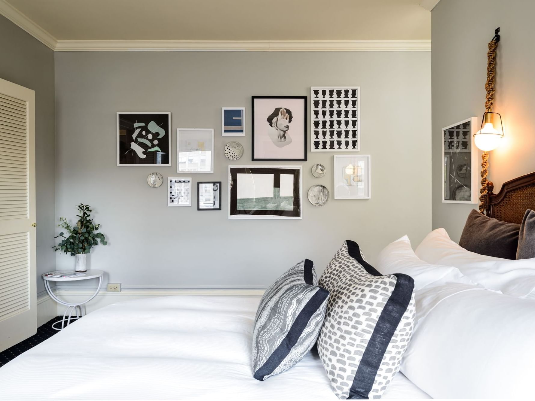 hotel bedroom with photo collage on the wall