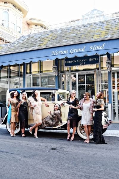 Vintage car in front of Horton Grand Hotel with girls