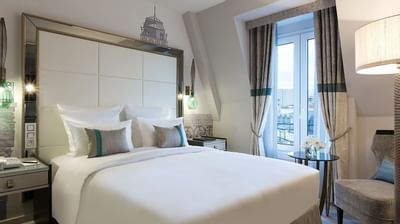 Bed & furniture in Deluxe Room at Hilton Paris Opera Hotel