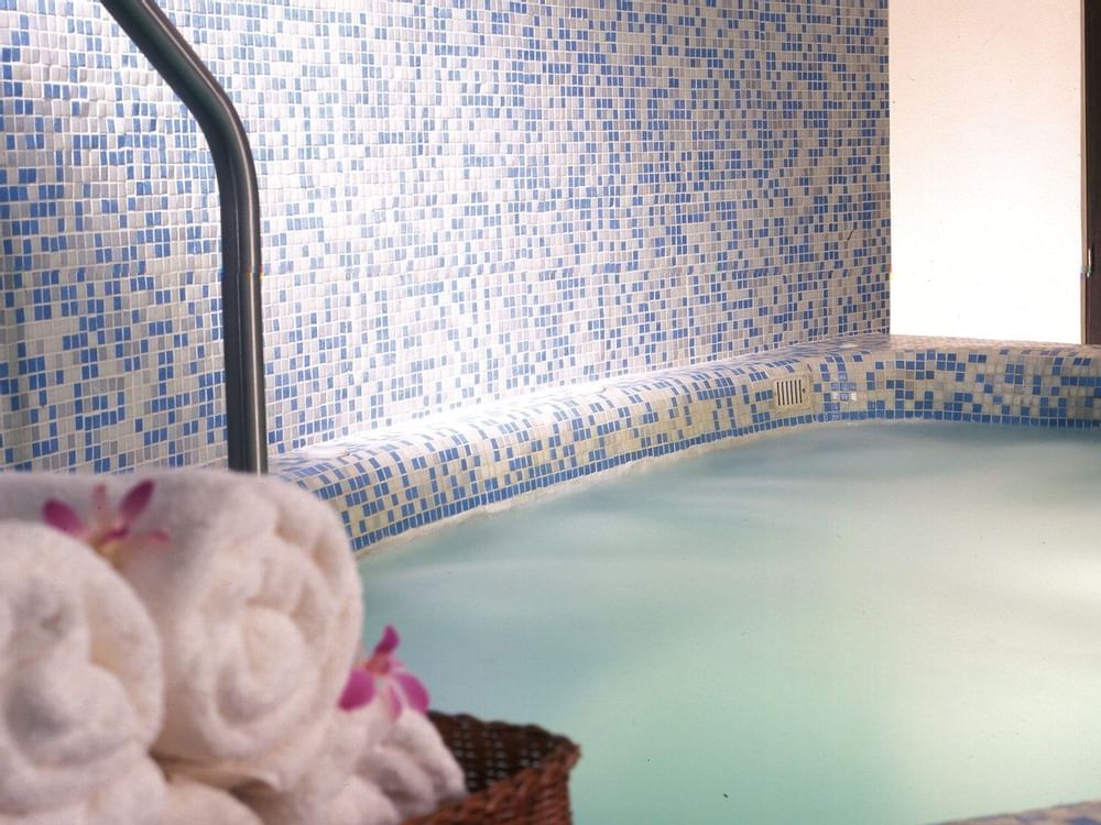 Indoor spa pool with towels at Live Aqua Beach Resort Cancun