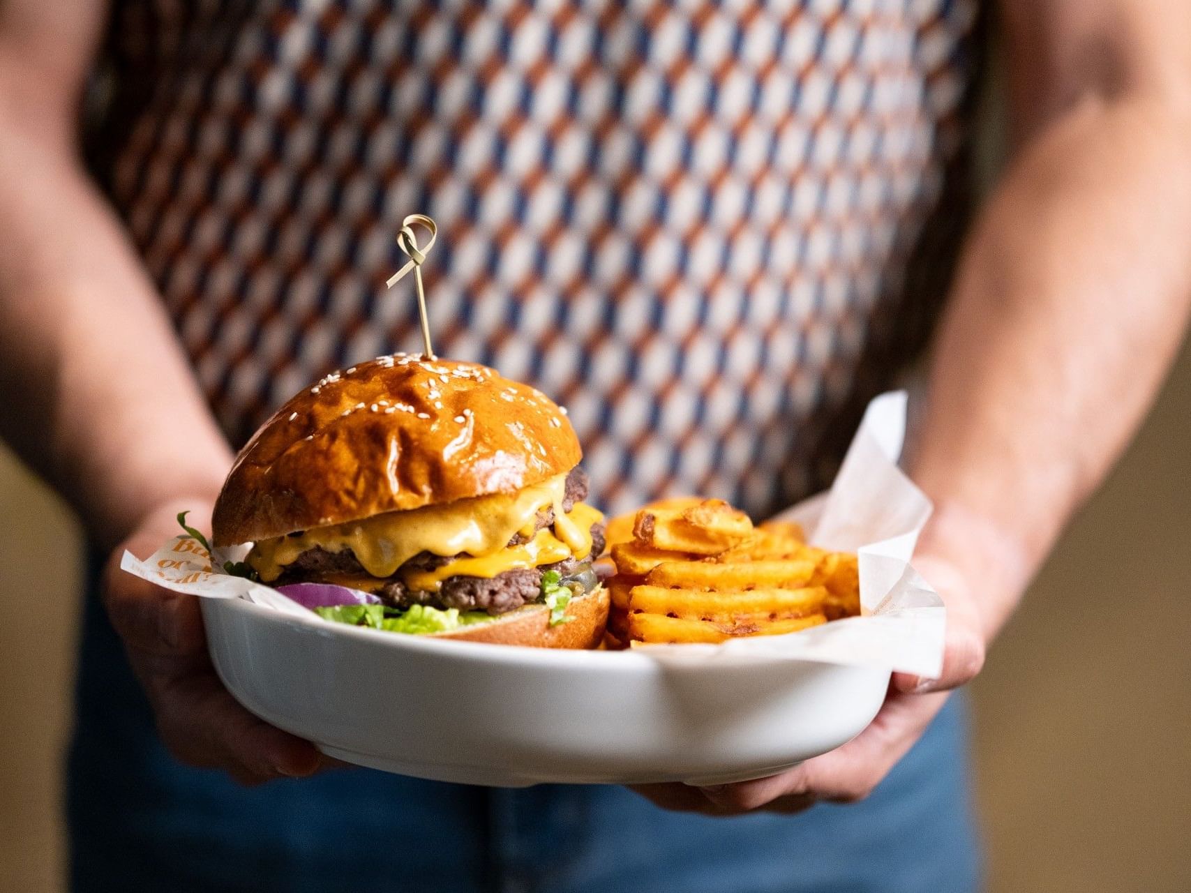 Delicious double cheeseburger topped with melted cheese served in Tavern on The Quays at Sandman Sheffield Quays