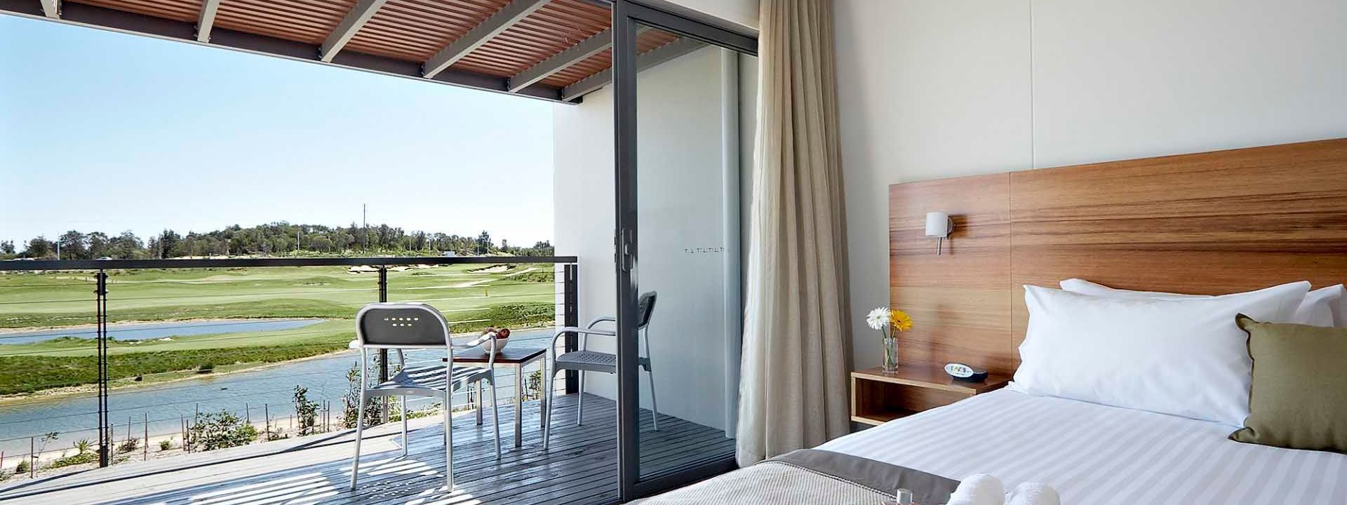 Balcony view of the lake & golf course from Studio Guestroom at Pullman Magenta Shores