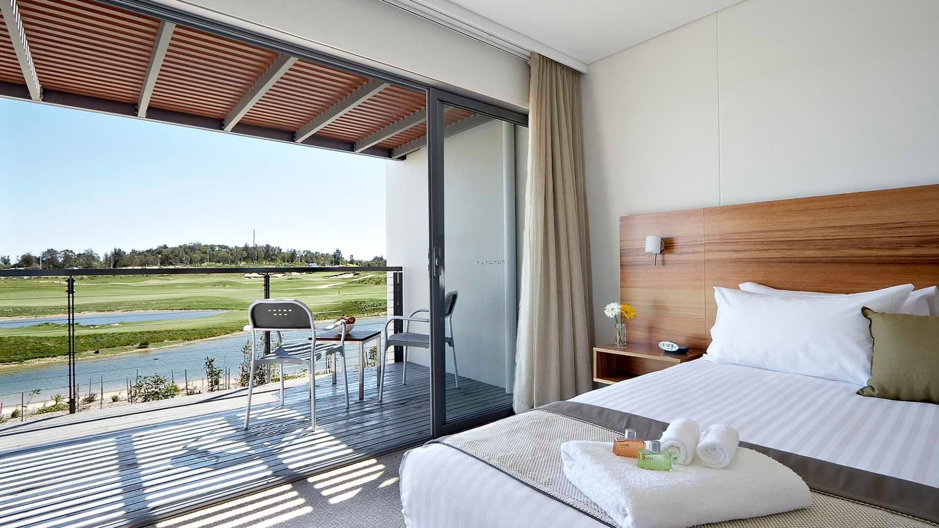 Balcony view of the lake & golf course from Studio Guestroom at Pullman Magenta Shores