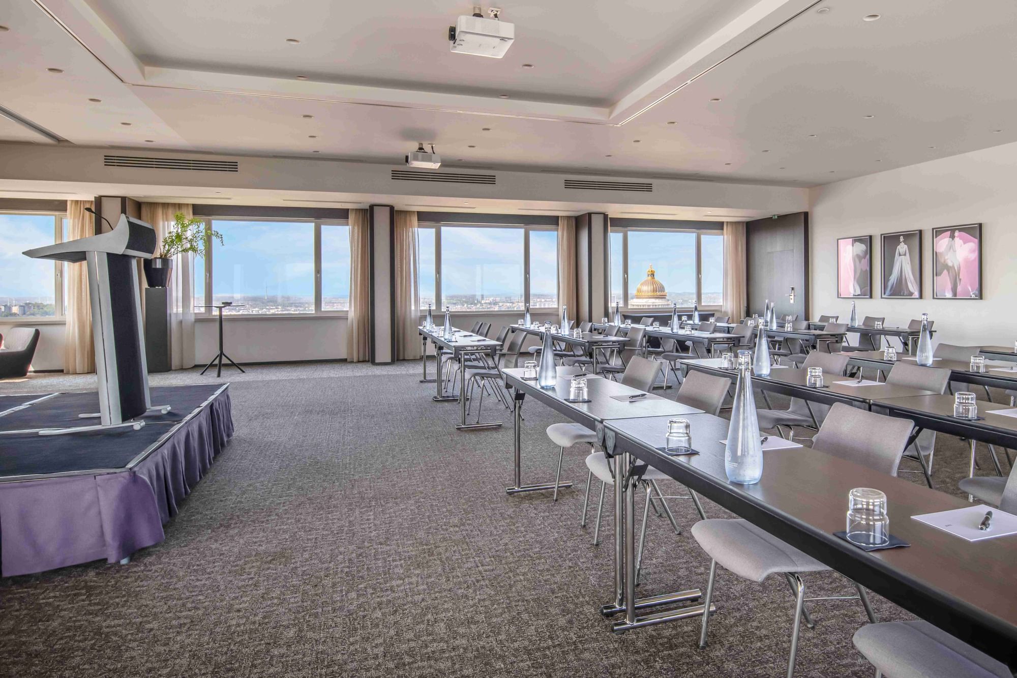 Classroom setup conference room with wooden tables & metal chairs at The Hotels Brussels