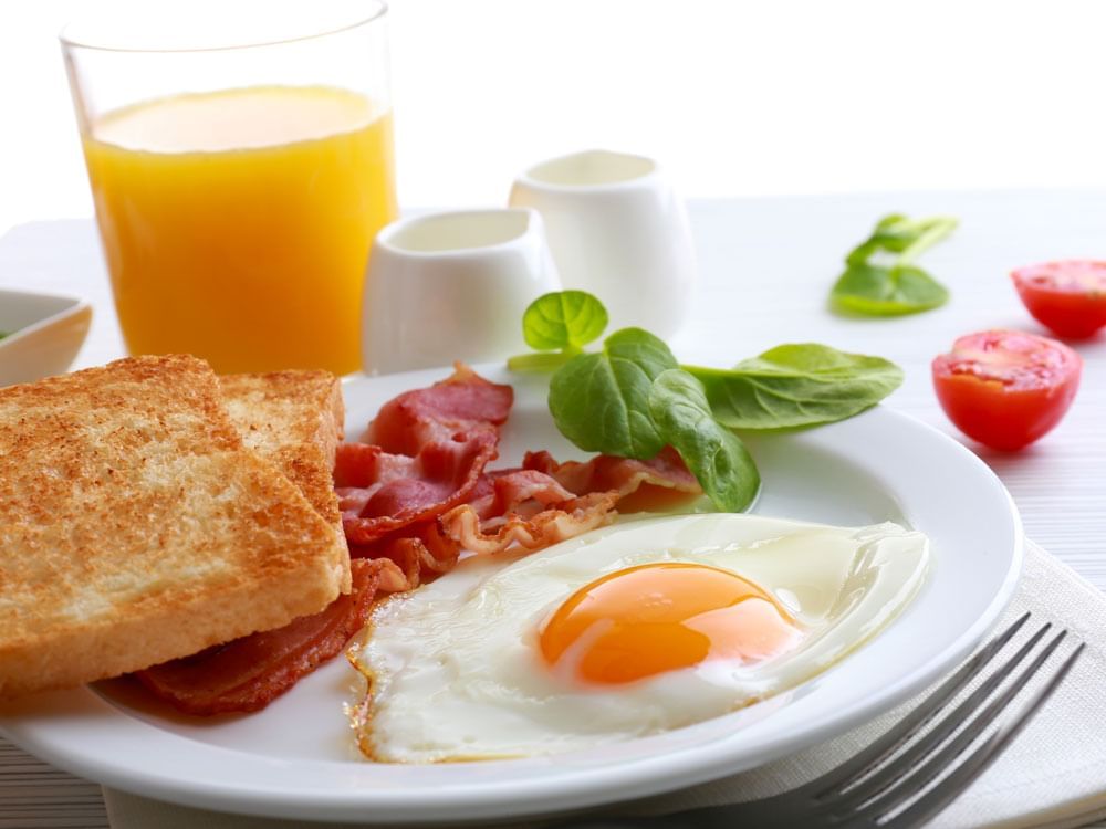 Delicious breakfast including bread, eggs, and orange juice served at Harrison Hot Springs Resort