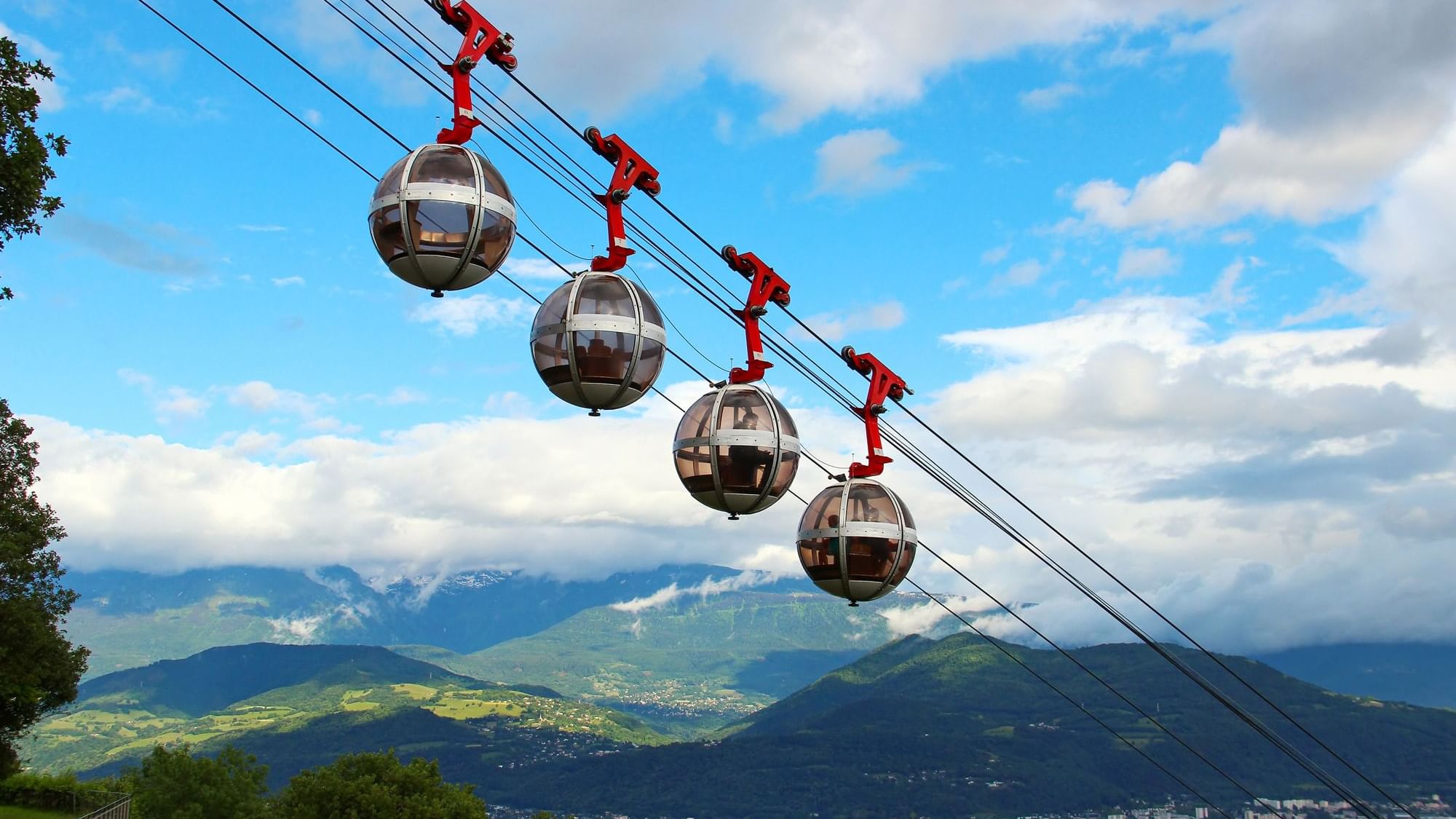 Closeup of cable cars in Grenoble near the Originals Hotels