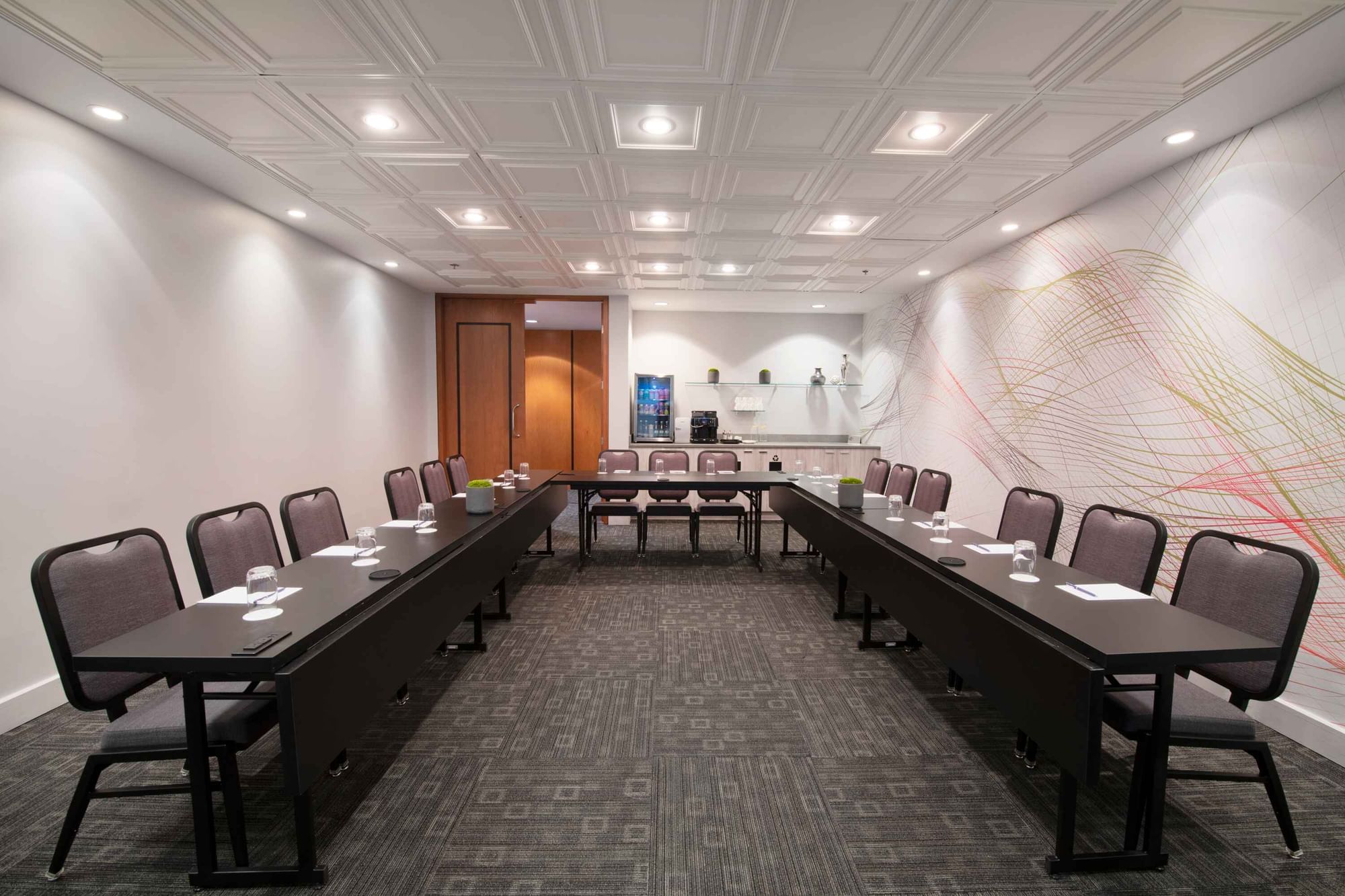 U-shaped table set-up with carpeted floors in Salon Stanley at Warwick Hotels and Resorts
