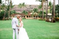 Wedding photo on the great lawn located at Waimea Plantation Cottages