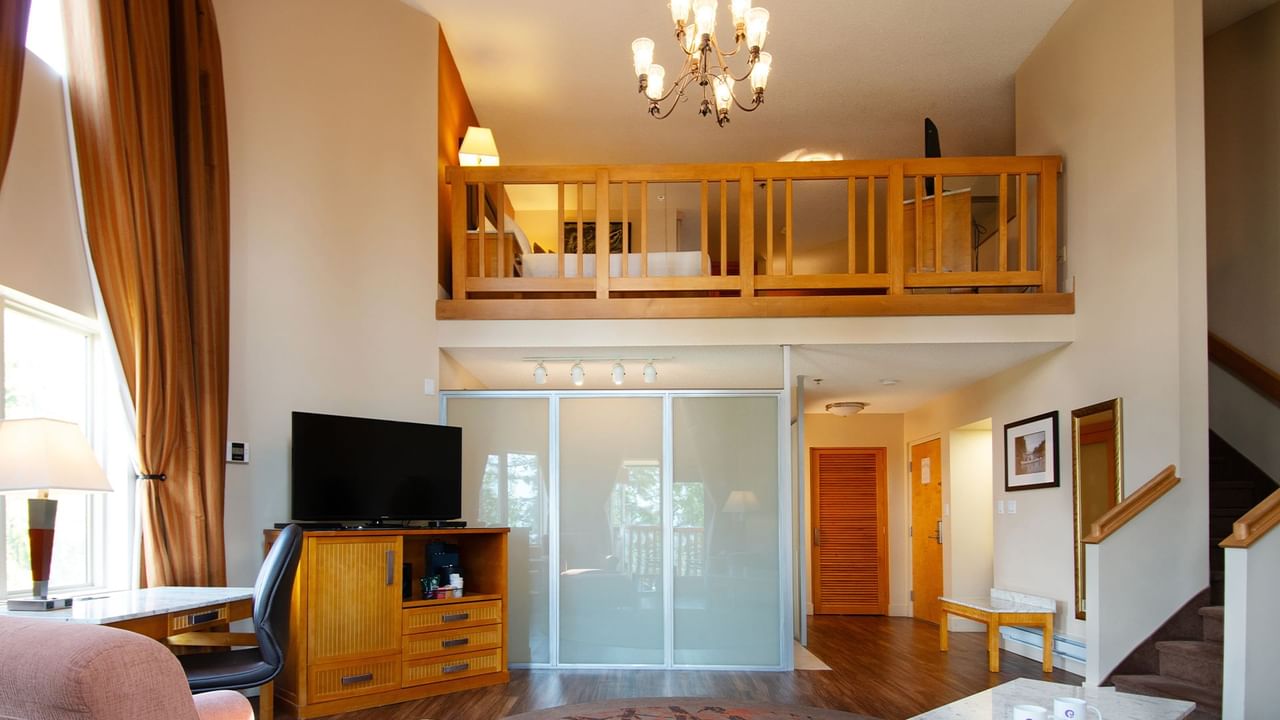 Loft suite with large living area a bedroom on the second floor