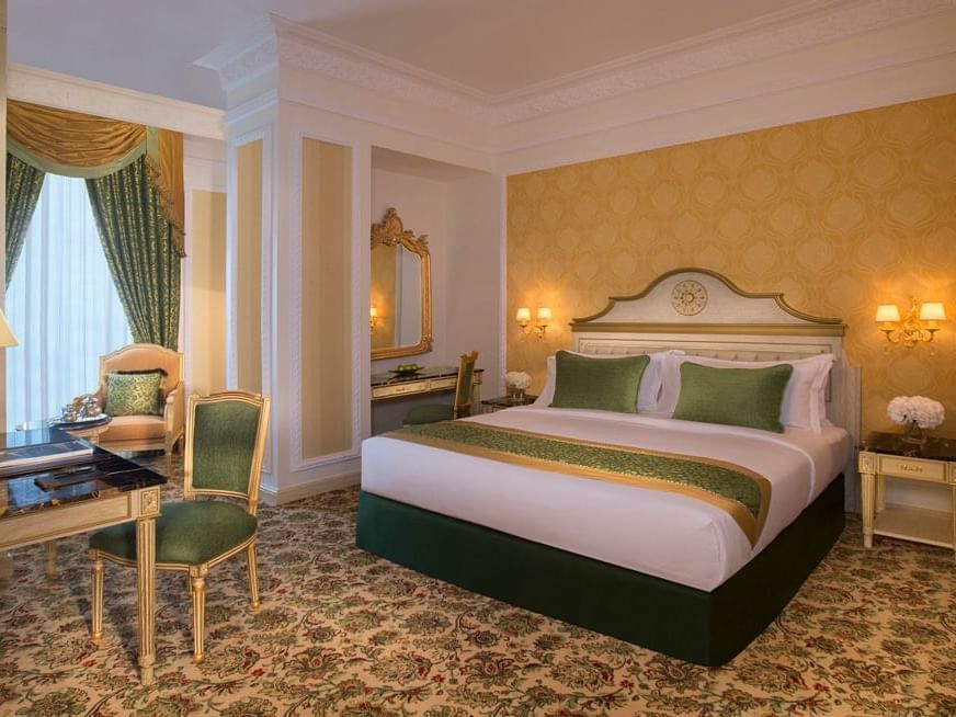 Bed & furniture in Grand Deluxe Room at City Seasons Hotels