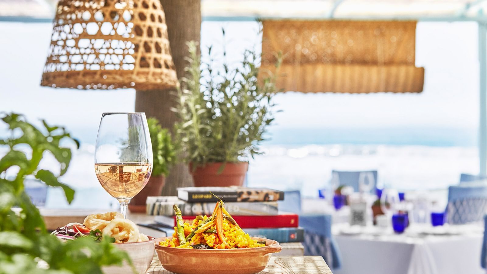Closeup on a dish & wine served in MC Beach at Marbella Club