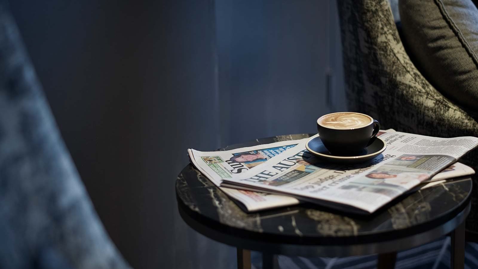 News paper time with tea cup at the pullman melbourne on the park