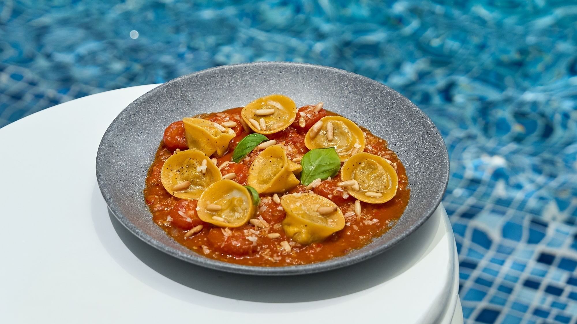 Ravioli served by the pool in Malibu Deck Pool Bar & Lounge at Paramount Hotel Dubai
