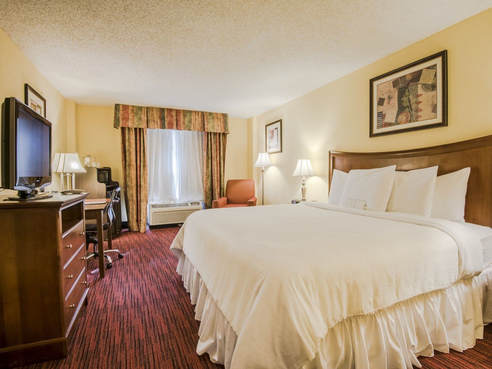 Dallas Concierge King with king bed at MCM Elegante Suites