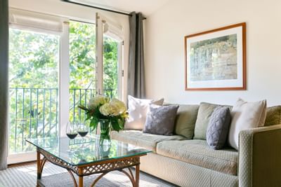 King preferred room living area with couch and table