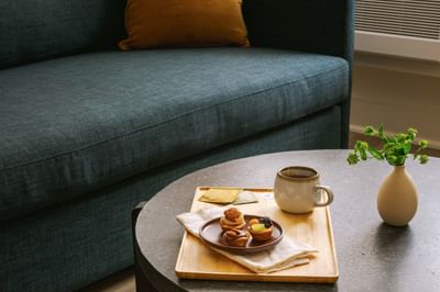 Afternoon cup of tea and plate of sweet pastries served in a room at Kenmore Village Hotel, best hotels in South Beach Miami