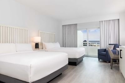 Two queen beds in the guestroom at Ocean Place Resort & Spa
