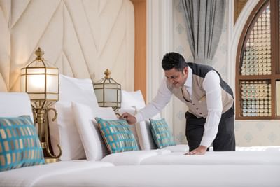 Room boy ready the bed in Standard Triple Room at Elaf Al Taqwa