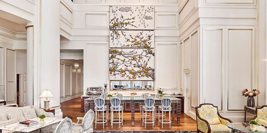 Park Lounge with high ceilings, a floral art piece, stylish bar seating, and chic furnishings at Park Hyatt Saigon