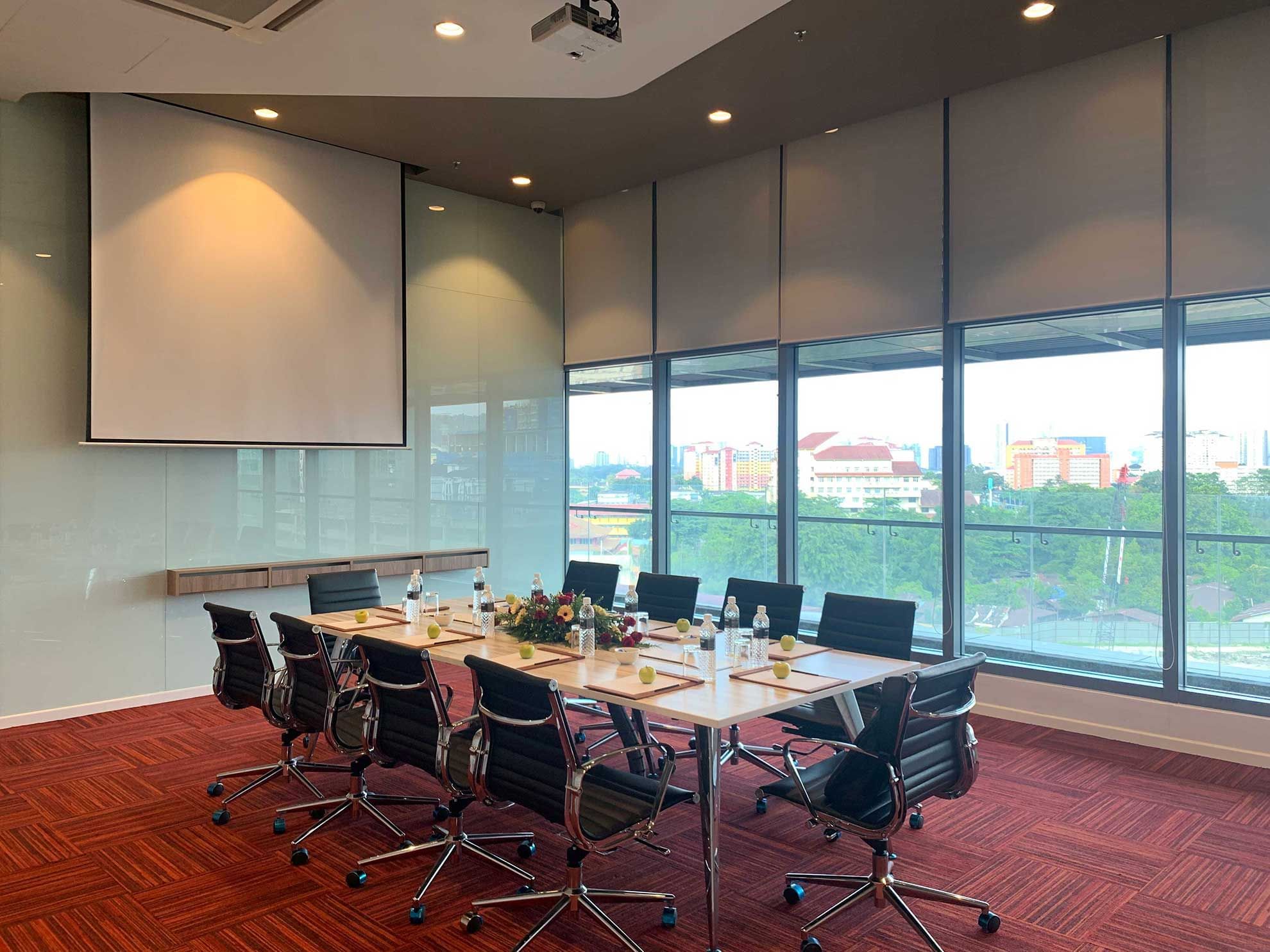 Boardroom set-up with digital screen in a meeting room at Sunway Velocity Hotel