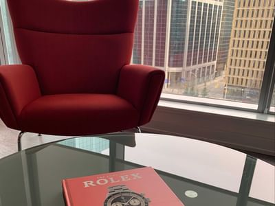 A magazine on a table by a chair at ReStays Ottawa