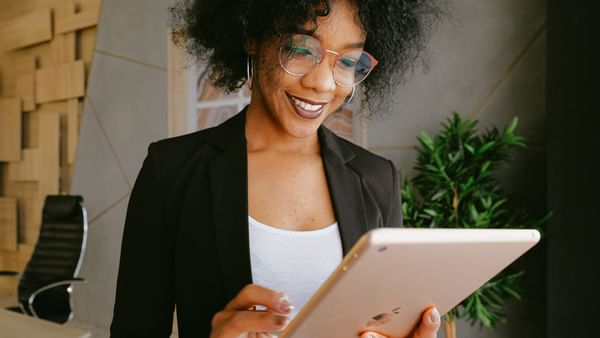 Businesswoman with glasses looking at ipad