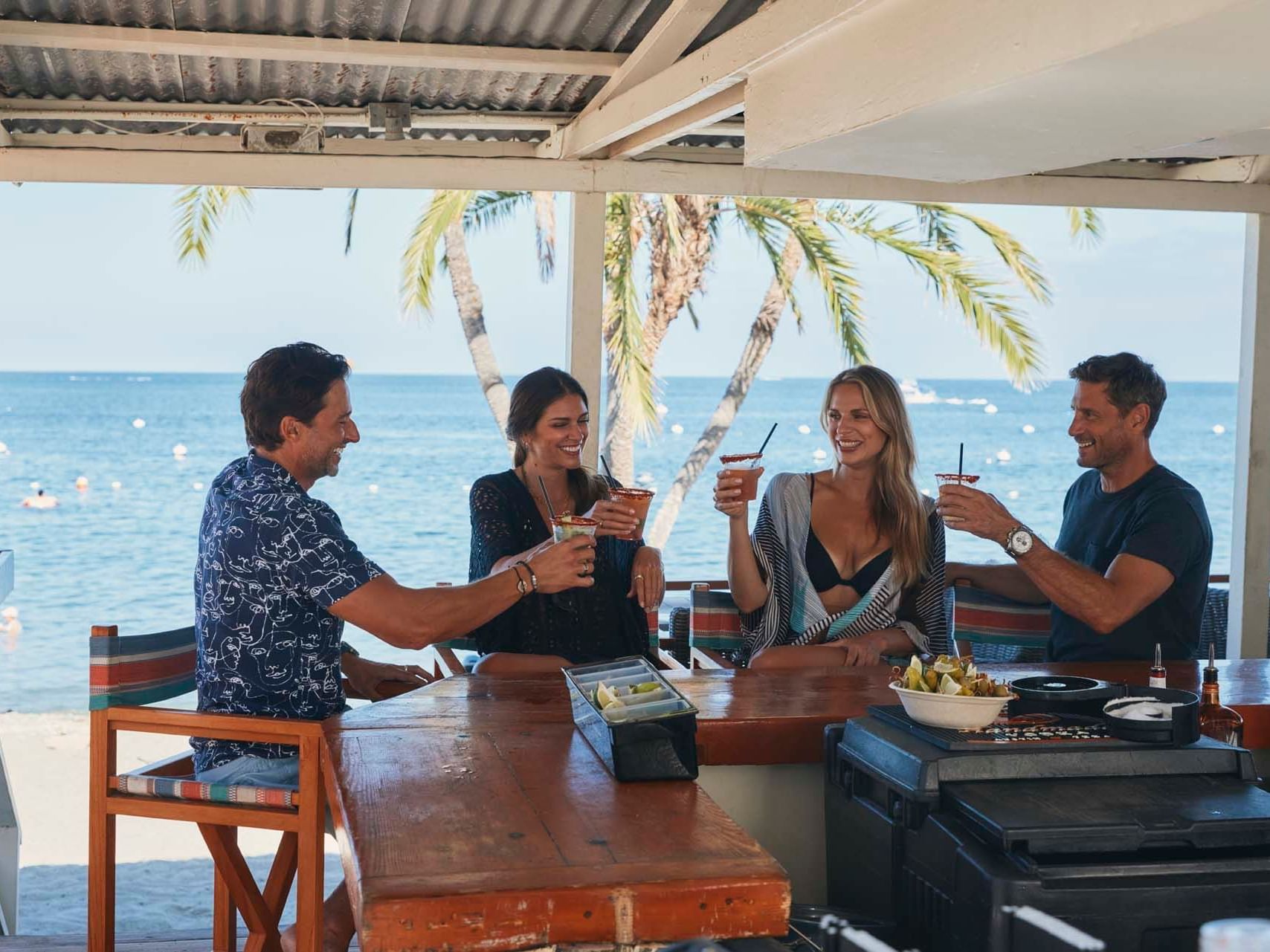 Group of people toasting their drinks in Catalina island wine tasting near Hotel Atwater