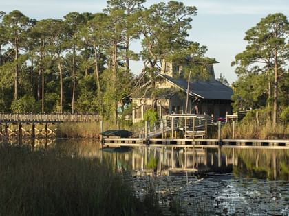 A Distant view of a Boathouse by the lake at WaterColor Inn