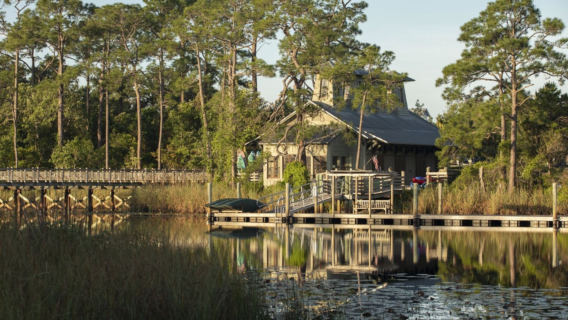 A Distant view of a Boathouse by the lake at WaterColor Inn
