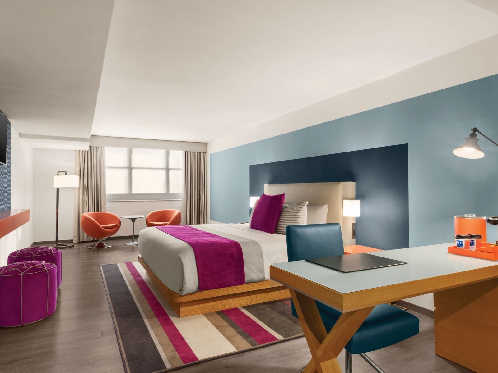 TRYP by Wyndham Isla Verde TRYP by Wyndham Isla Verde hotel room with bed, desk and accent chairs with table