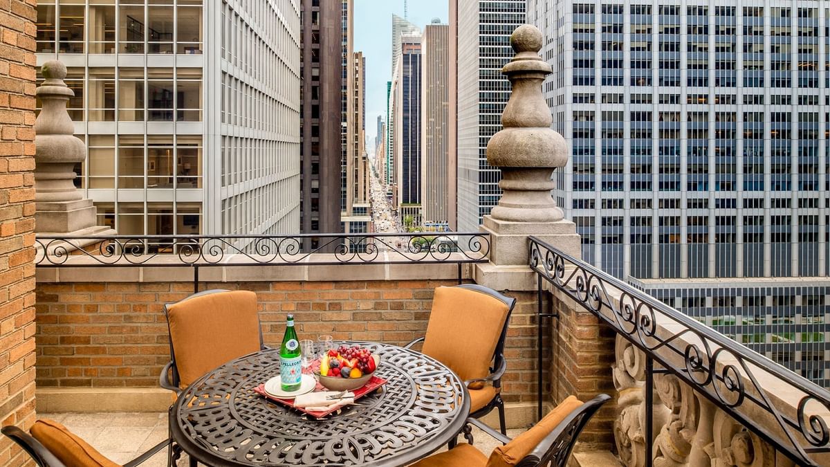 Balcony terrace dining area overlooking the city in Premier City View 2 Double Beds with Terrace at Warwick New York