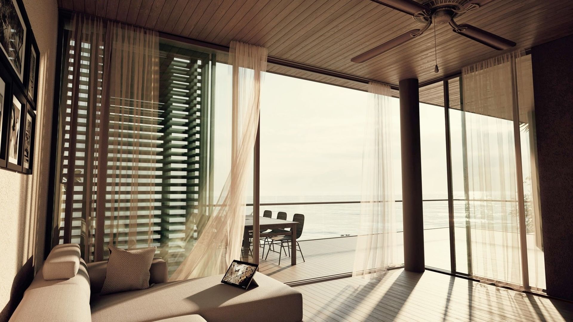 Living room with floor-to-ceiling windows and stunning ocean views in BlueZone Villas at A'ila Villas