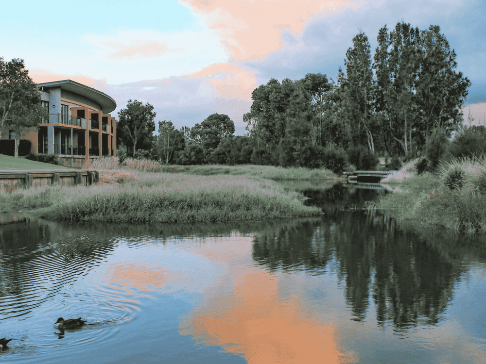 Sunset photo of kooindah waters lake with apartments