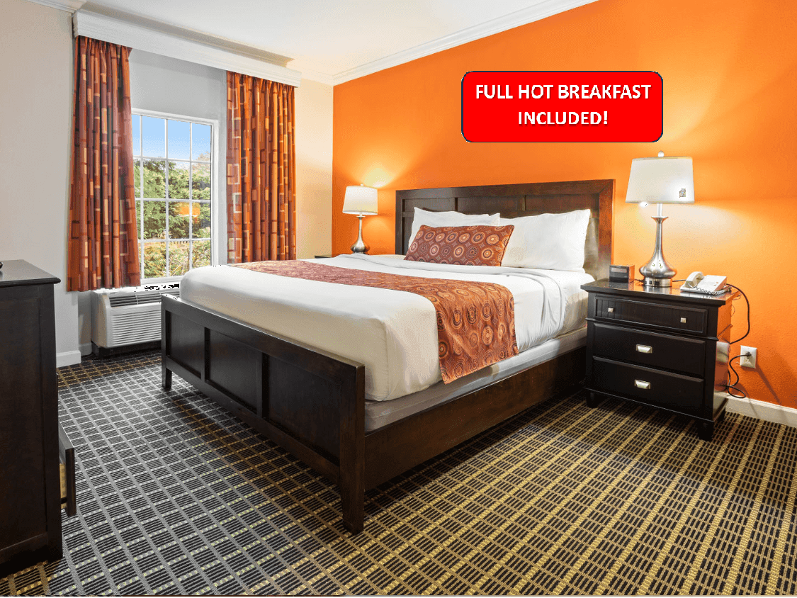 Bedroom with an outdoor view in King Suite With Private Jacuzzi at The Wilshire Grand Hotel