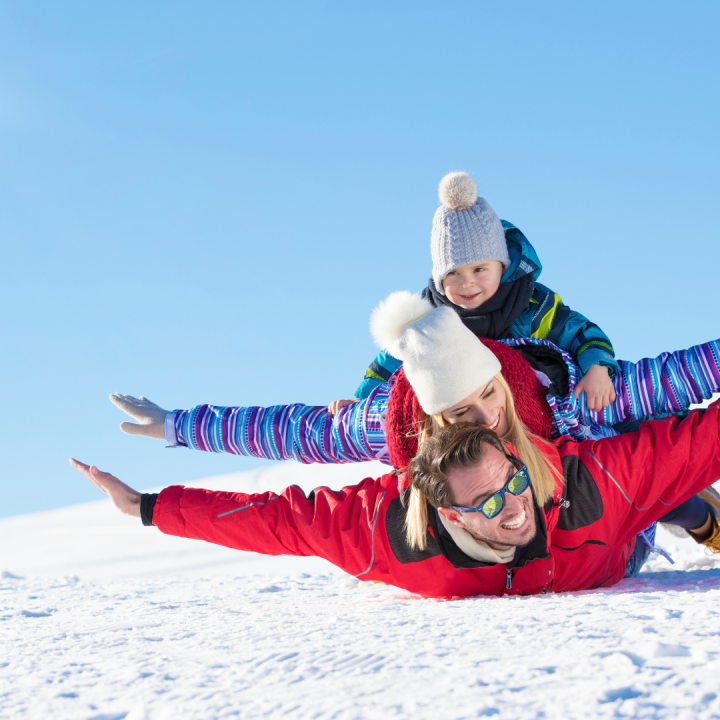 A man and his family are enjoying the Winter Getaway at Summit Lodge Boutique Hotel in Whistler.