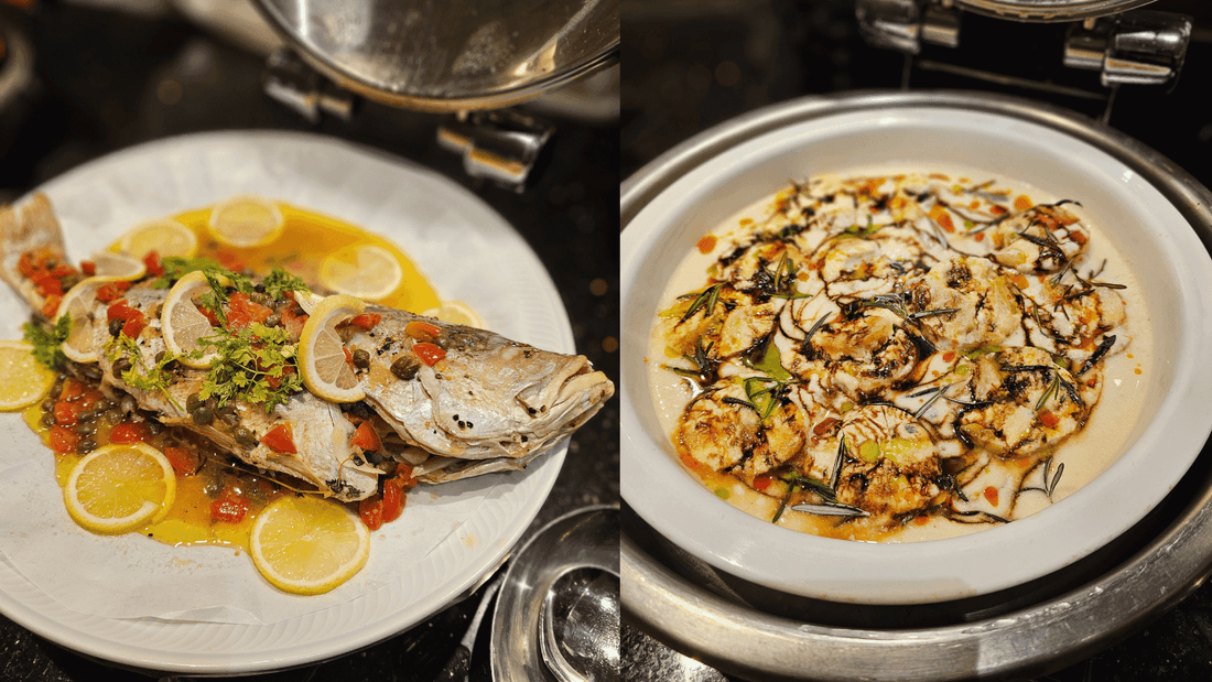 A fish garnished with lemon, and a plate of seasoned scallops served at Sunway Putra Hotel