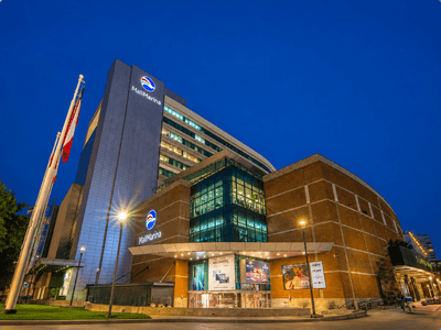 Exterior facade featuring illuminated signage and outdoor lighting highlighting vina del mar Chile hotels at Veranda Hotel