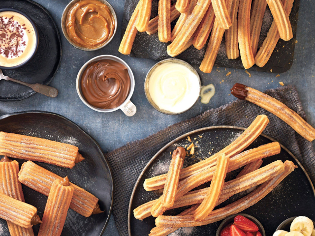 Churros and chocolate served on a table in San Churro at Brady Hotels Jones Lane