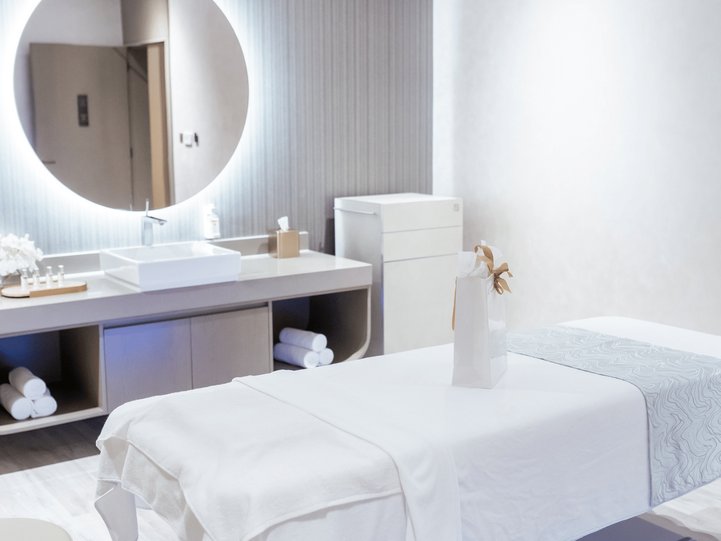 Spa bed, sink, and spa amenities in Pause Spa Château Berger at Paramount Hotel Midtown