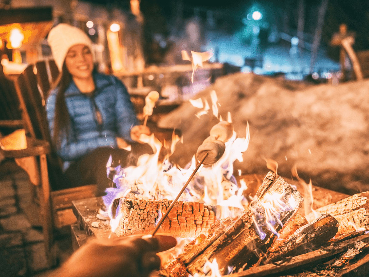 Close-up of marshmallow roasting by a firepit at Blackcomb Springs Suites