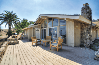 Exterior view and seating with wooden floor at Casa Santa Rosa 