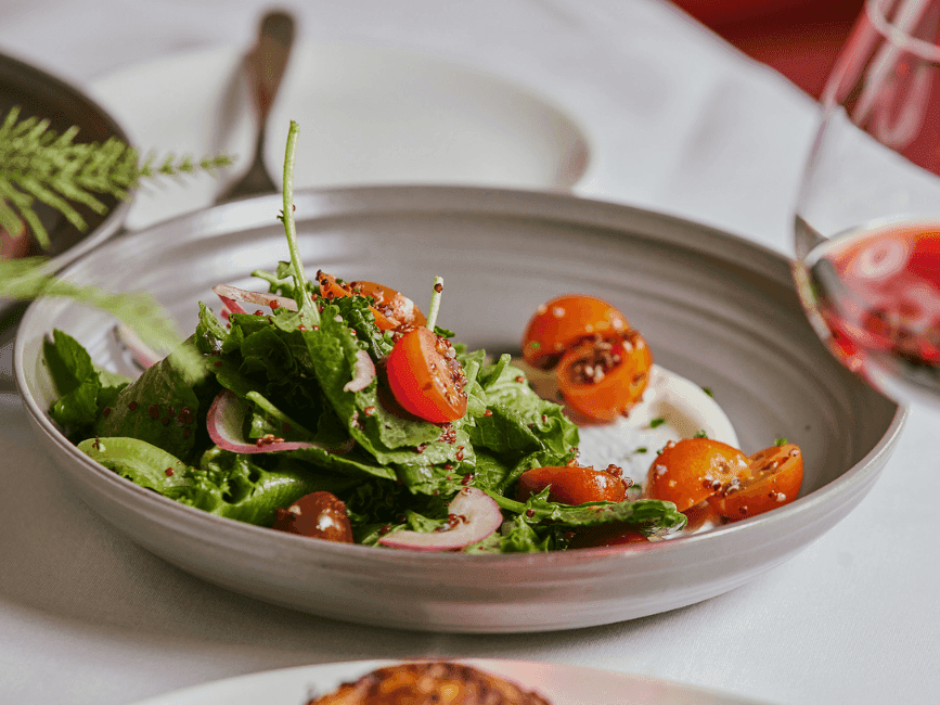 Salad dish served on the dining table at The Centennial Hotel