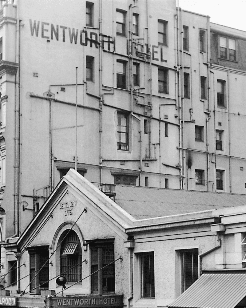 Black and white image of a street view of the front of the Wentworth Hotel.