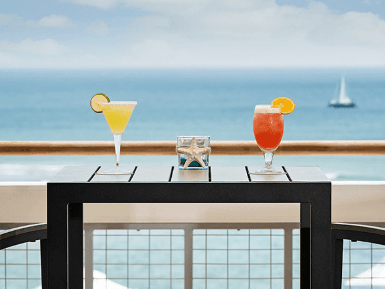 Cocktails served on a table with elevated views in Surf Point 360 at Ogunquit River Inn