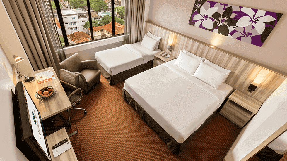 Two twin beds and TV in Deluxe Twin Room at Sunway Putra Hotel