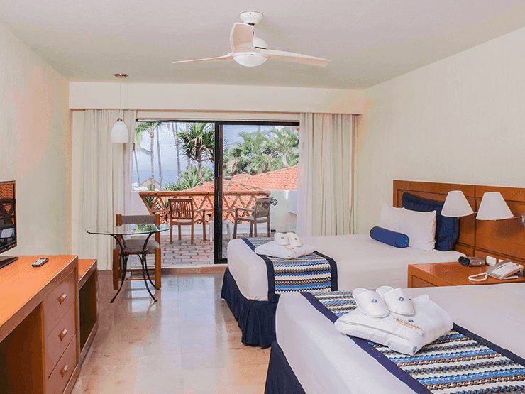 ILUMINATED ROOM OF TWO DOUBLE BEDS