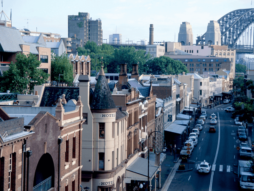 Cityscape with buildings and the iconic bridge in the background at The Rocks.
