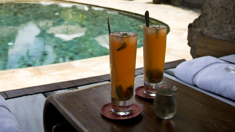 Close-up of juice served by the pool at Warwick Ibah Villas